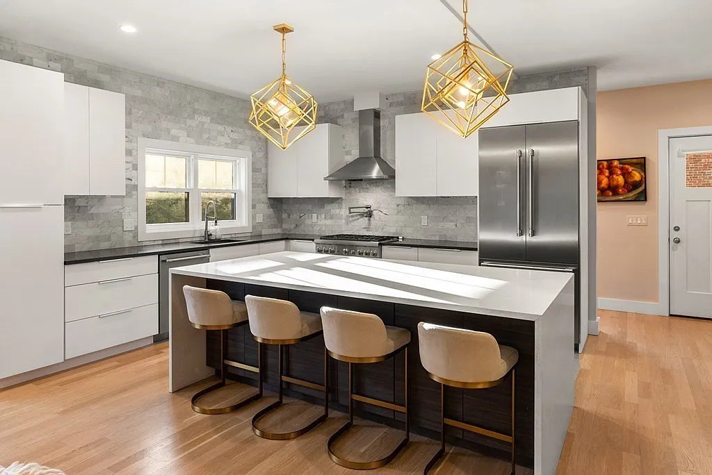 Modern Brookline kitchen with brass pendant chandeliers installed by T-Key Handyman